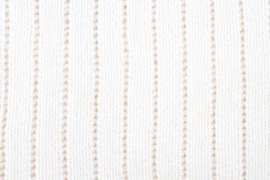 Süveter ya da atkı renginde büyük bir örgü. Örgü arka plan. Yünlü el yapımı araba.