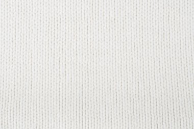 Süveter ya da atkı kumaş dokusu büyük örgü. Örülmüş forma ve kabartma desenli. Yün el yapımı makine, el yapımı.