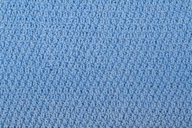 Süveter ya da atkı kumaş dokusu büyük örgü. Örülmüş forma ve kabartma desenli. Yün el yapımı makine, el yapımı.