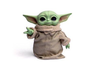 Springfield, MO United States - June 01, 2025: Grogu doll figure from the Mandalorian Star Wars series isolated on a white background. 