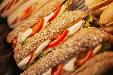 Delicious fresh sandwiches with cheese, bread, tomato, sausage healthy snack or breakfast