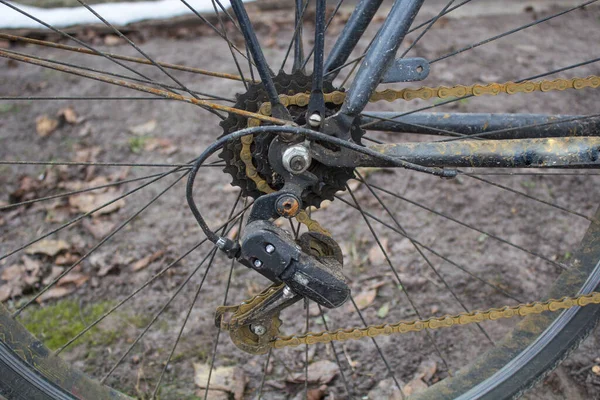 Bicycle with a rusty bicycle chain, sprockets, ratchet.
