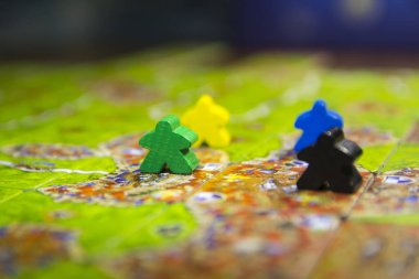Board game carcassonne with chips close-up.