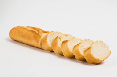 Sliced french baguette on a white background with space for text.