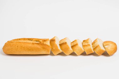 Sliced french baguette on a white background with space for text.