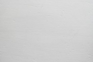 White background with copy space. Light putty on the wall.
