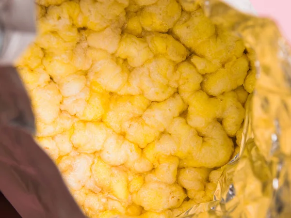 Fitness food, dietary bread made of corn in a foil package close-up.