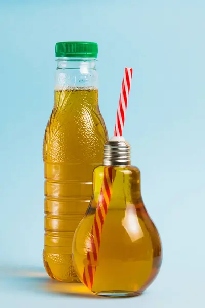 Juice Plastic Bottle Drink Reusable Glass Bottle Blue Background Concept — Stock Photo, Image