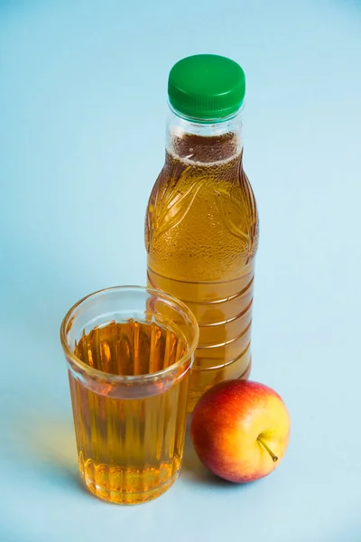 Apple Juice Drink Plastic Bottle Reusable Glass Cup Blue Paper — Stock Photo, Image