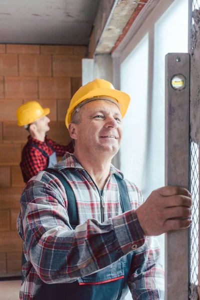 Happy Senior Industrial Male Worker Yellow Hardhat Checking Quality Construction — Stock Photo, Image