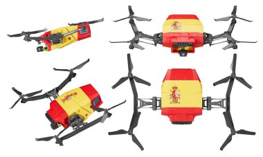 Fotoğrafta, İspanyol bayrağının canlı kırmızı ve sarı renkleriyle süslenmiş insansız hava araçları ve koyu bir arka plan üzerinde uçuşun ortasında yakalanan armalar yer alıyor.