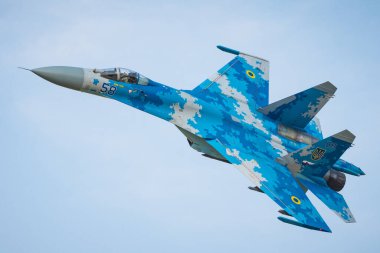 RADOM, POLAND - AUGUST 27, 2017: Ukrainian Air Force SU-27 AB fighter fly over Radom airfield clipart