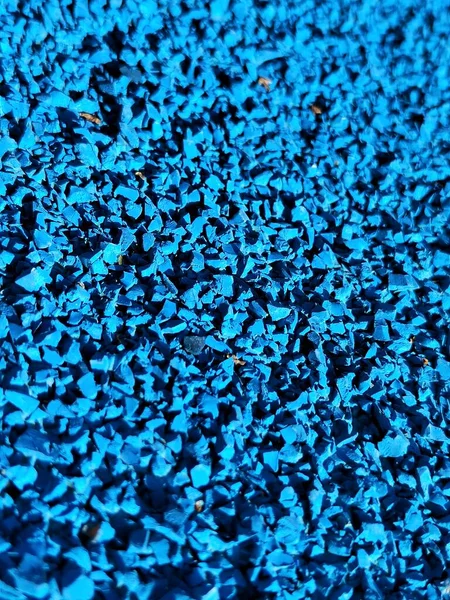 Blue tartan running track close-up