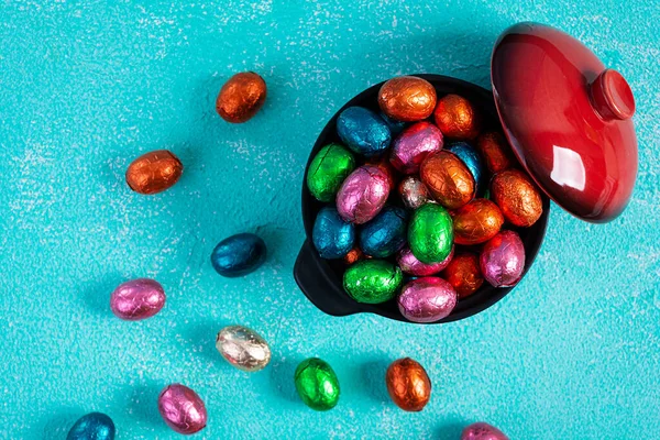 Colorful background of Easter chocolate eggs. Delicious chocolate eggs. Top view