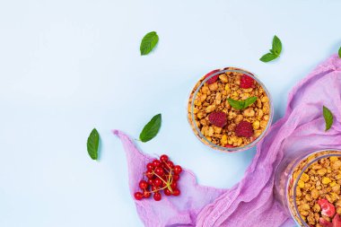 Yogurt with granola and berries. Healthy breakfast. Muesli, oats and yogurt