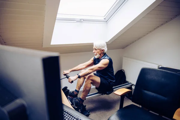 Indoor Portrait Senior Man Working Out His Rowing Machine His Stock Photo