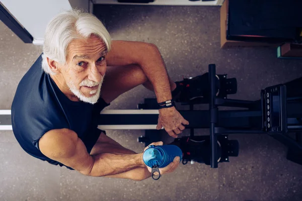 Indoor Portrait Senior Man Working Out His Rowing Machine His Stock Picture