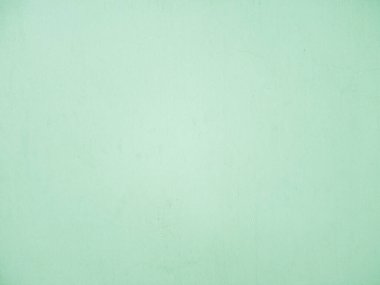 Bina duvarındaki pastel yeşil arka plan.