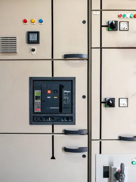 The switch controls the operation of the water production system in front of the electrical circuit cabinet, front view with the background.