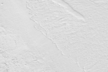 Beyaz kum dokusu zemininin ve duvarın klasik ya da kirli arka planı, kumlu plajlar, rahatlama ve tatil için bir metafor olarak yapılarda ve iç tasarımlarda kullanılan retro model düzeni olarak kullanılır. 