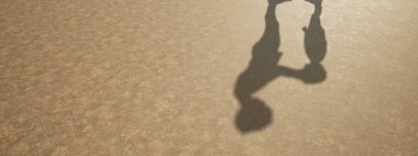 Görüntü olarak insan gölgesi olan zemin dokusu yüzeyinin kavramsal veya kavramsal arkaplanı. Çocukluk eğitiminin 3 boyutlu bir metaforu, eğlenceli mutlu aile çocuk ebeveyn ilişkisi tasarımı