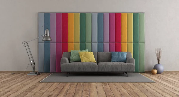 Colorful fabric paneling in a modern room with gray sofa on hardwood floor - 3d rendering