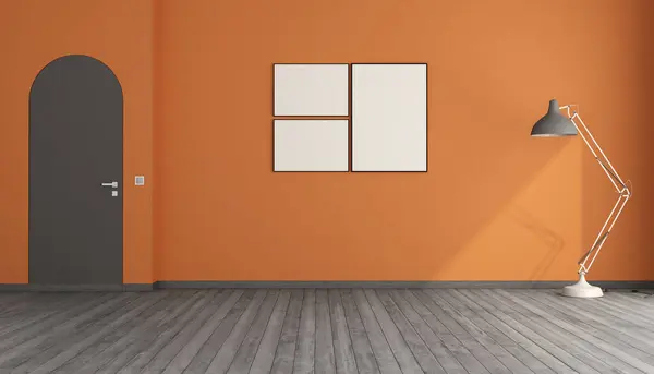 オレンジ色の壁 アーチされたフレームレスなドア 空白の絵フレームおよび床ランプが付いている空の部屋3Dレンダリング ストックフォト