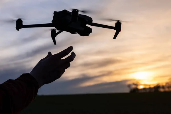 Aerial Drone Lands on the Palm of a Hand