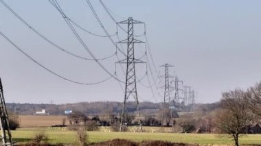 Rows of High Voltage Lattice Power Line Towers Aerial View