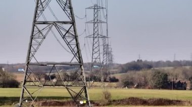 Rows of High Voltage Lattice Pylon Power Line Towers Aerial View