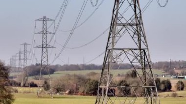 Rows of High Voltage Lattice Pylon Power Line Towers Aerial View