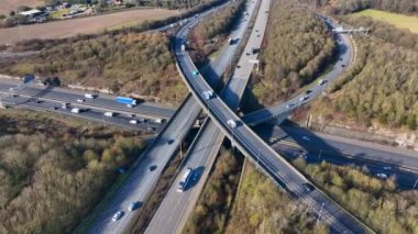 Rush Hour Vehicles Driving on a Motorway Interchange UK Aerial View