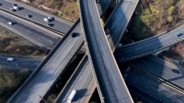 Vehicles Driving Along a Busy Motorway Interchange in the UK Aerial View