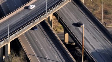 Vehicles at Rush Hour Driving Through a Freeway Intersection Aerial View