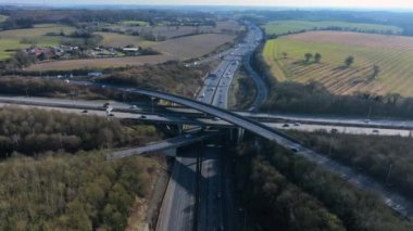 Vehicles at Rush Hour Driving Through a Freeway Intersection Aerial View