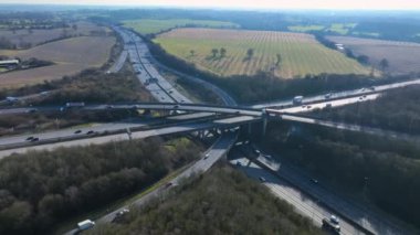 Vehicles at Rush Hour Driving Through a Freeway Intersection Aerial View