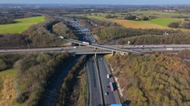 Vehicles at Rush Hour Driving Through a Freeway Intersection Aerial View