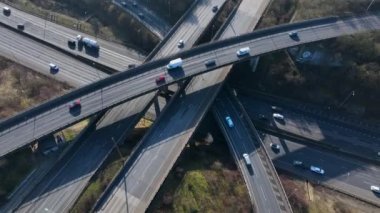 Rush Hour Vehicles Driving on a Highway Interchange Junction Aerial View