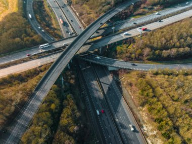 Vehicles Driving Along a Busy Motorway Interchange in the UK Aerial View