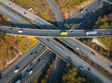 Rush Hour Vehicles Driving on a Motorway Interchange UK Aerial View