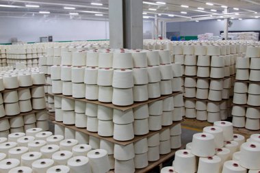 LUANNAN - MARCH 13: Cotton-waste piled up in the production workshop in a spinning production company, March 13, 2013, Luannan County, Hebei Province, china