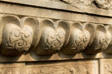 Broken rock carving decorative pattern, closeup of photo
