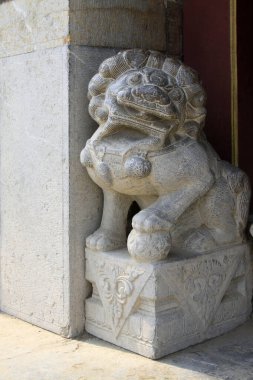 beast sculpture on the rock in a temple, closeup of photo