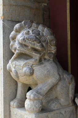beast sculpture on the rock in a temple, closeup of photo