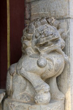 beast sculpture on the rock in a temple, closeup of photo