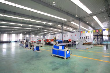 TANGSHAN CITY - MAY 28: Large machinery and equipment in a production workshop, on may 28, 2014, Tangshan city, Hebei Province, Chin