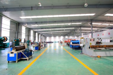 TANGSHAN CITY - MAY 28: Large machinery and equipment in a production workshop, on may 28, 2014, Tangshan city, Hebei Province, Chin