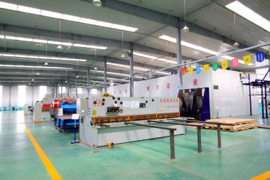 TANGSHAN CITY - MAY 28: Large machinery and equipment in a production workshop, on may 28, 2014, Tangshan city, Hebei Province, Chin