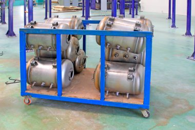Stainless steel pressure tank piling up together, closeup of photo