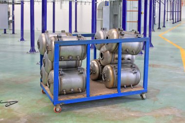 Stainless steel pressure tank piling up together, closeup of photo